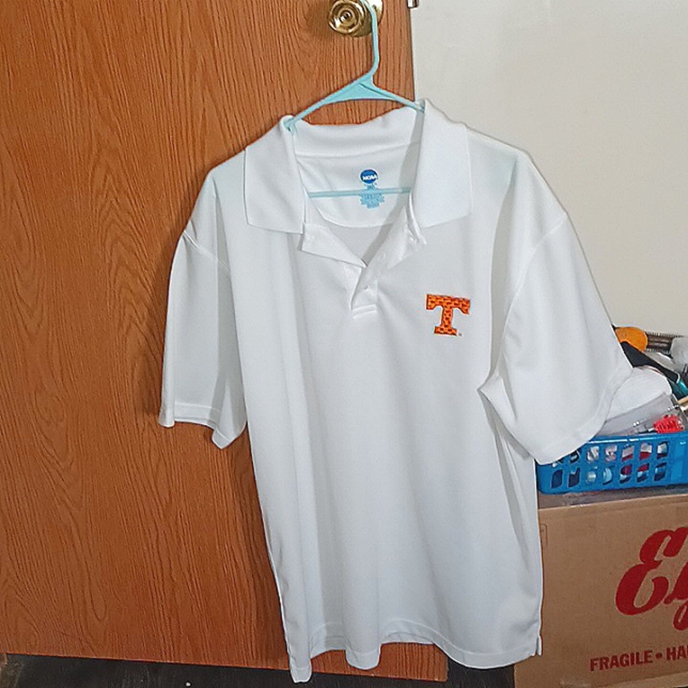 NCAA Tennessee shirt Is white with orange T on it, Really nice shirt